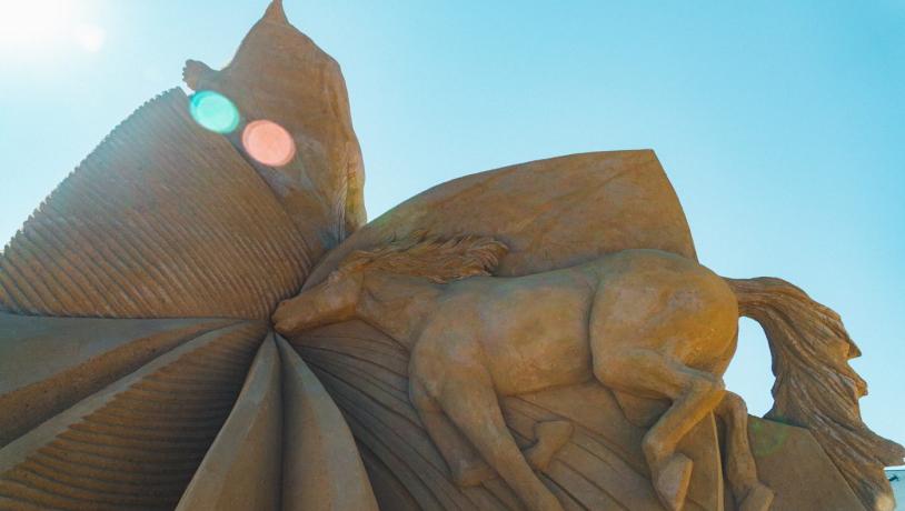A horse floats away in this sand sculpture in Hundested Sand Sculpture Park.